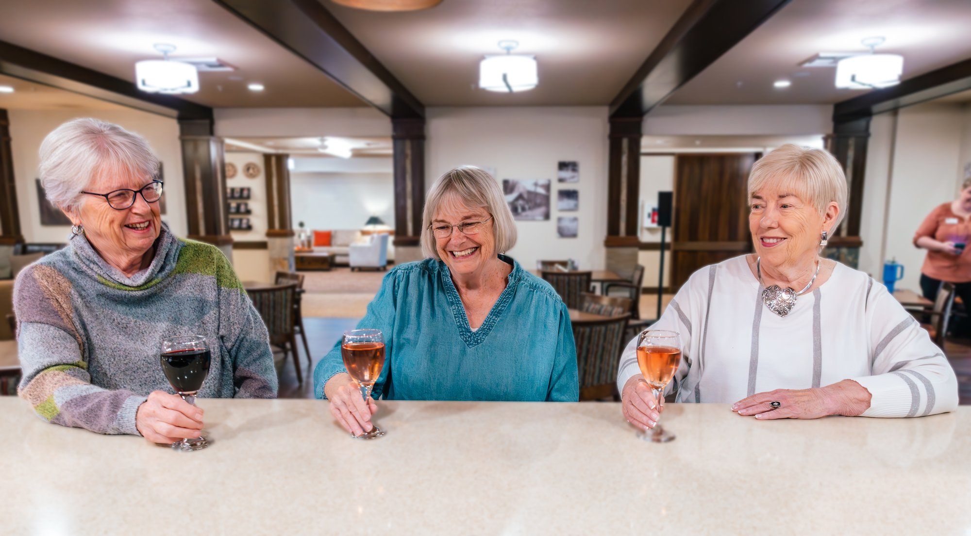 Three older women at a happy hour