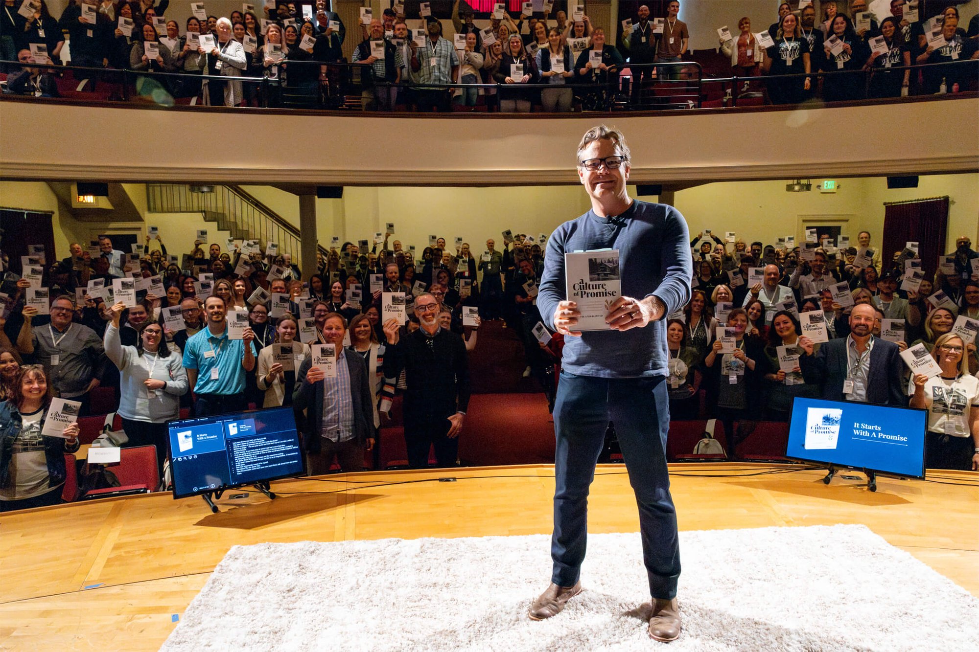 Picture of Fee on stage at Leadership Conference 2024 at Linfield University in McMinnville, Oregon.