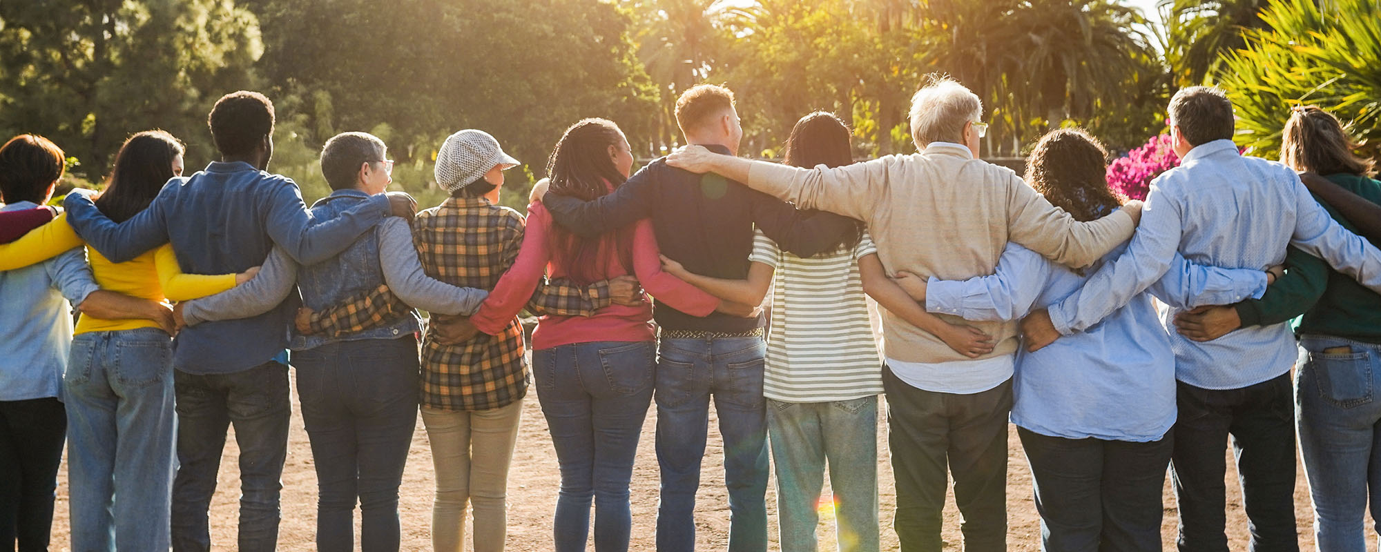 Group of multigenerational people hugging each others