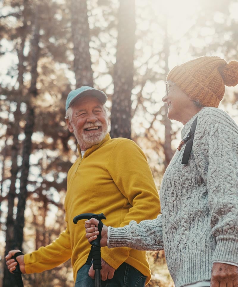 senior couple hiking in fall