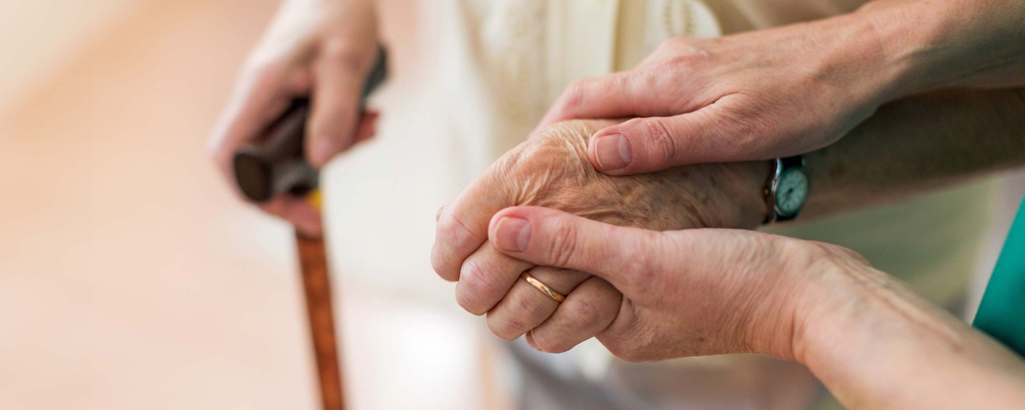 staff member helping resident walk