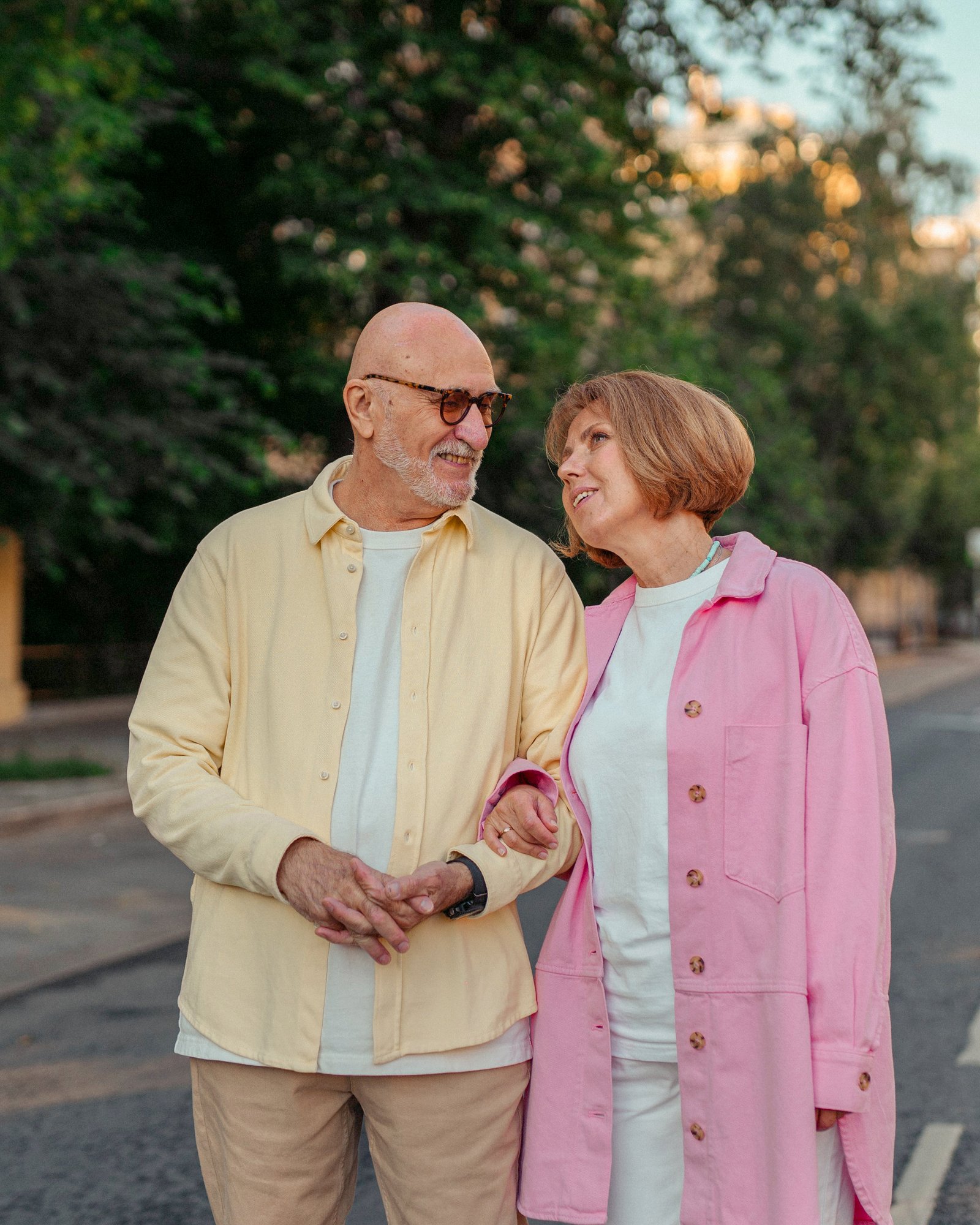 Older couple walking and looking at each other